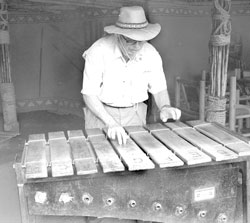 Joe tries out a handcrafted instrument.