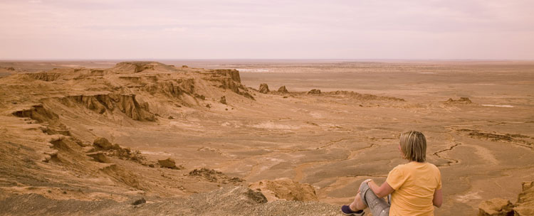 Similar to the rugged red-rock canyons of the American Southwest, the Flaming Cliffs of Bayanzag is where American paleontologist Roy Chapman Andrews discovered dinosaur skeletons and eggs in 1922.