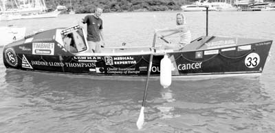 Richard Mayon-White and Liz O’Keeffe of team Row4Cancer aboard their vessel “Bilbo Baggins.” Liz shows her rowing position just before being thrown overboard in one of the four rollovers the team suffered during the transatlantic race. Photos: Toulmin