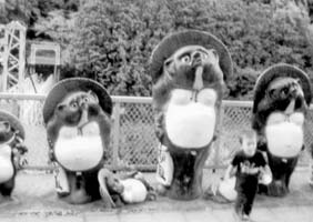 Tanuki figures near the train tracks in Sagano. Photo: McClure