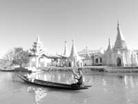 Canoes are the most common form of transportation on Inle Lake’s many small channels. Photos by Donna Judd