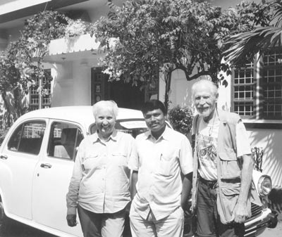 Lorna Tjaden and Carl Weiser with a driver and car.