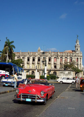 Classic autos compete for attention with the Gran Teatro de la Habana on the Paseo del Prado. Photo: Keck