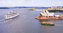 View from the top of the Sydney Harbour Bridge Pylon looking east at a cruise ship being escorted by a pilot boat to open ocean; at a Sydney ferry, and at the Sydney Opera House. Photo: Rychner