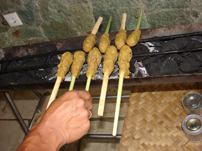 Grilling the fish satay.