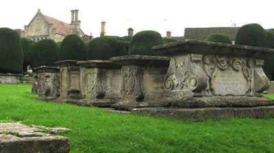 Table tombs and, in the background, yew trees in the St. Mary’s Church cemetery in Painswick, England. Photo: Schauss