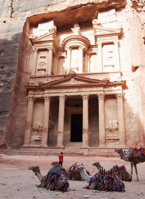 Camels await travelers in front of the Treasury.