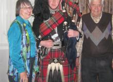 Anne and Jack Dini with a piper in Edinburgh. 