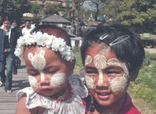 Woman and child with faces decorated — Mandalay