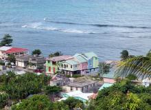 A number of recently built foreign-owned vacation cottages line the waterfront.