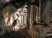 A recess off Postojna Cave’s walkway is filled with what appear to be icicles transformed into stone. Photo: Patten