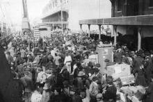 European emigrants crowd a dock in Antwerp, Belgium, before boarding a Red Star Line ship for New York.