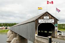 The Hartland Covered Bridge, built in 1901 and covered in 1921, is the world’s longest covered bridge, stretching 1,282 feet over the Saint John River in New Brunswick, Canada.