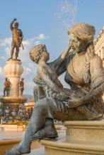 One of four statues of mothers around the Fountain of the Mothers of Macedonia in Skopje, North Macedonia. In the background, on a 15-meter-tall platform, is a 13-meter-tall bronze statue of Philip II, father of Alexander the Great.