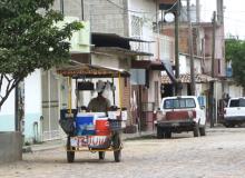 Man selling snow cones from his cart in Las Palmas, Mexico. Photos by Victor Block