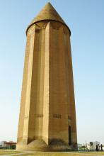 The early-11th-century tower Dome of Qabus stands on a low hill in northeastern Iran. Photo by David J. Patten