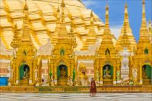 Two young monks walk the grounds of Shwedagon Pagoda in Yangon, the most sacred Buddhist shrine in Myanmar