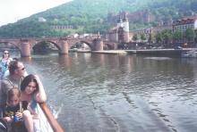 From the river, a view of the Old Bridge and castle in Heidelberg.