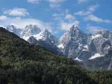 The road leading toward Mt. Vršič Pass offers dramatic alpine scenery.