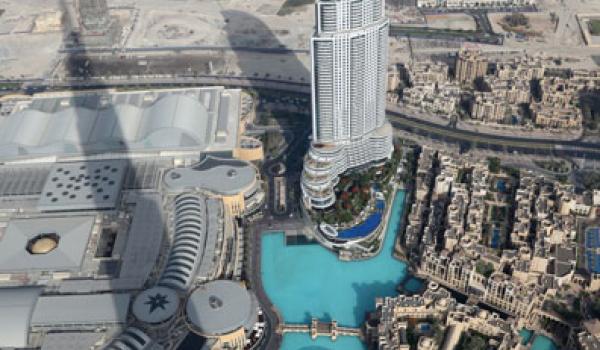 View of a man-made lake and the hotel The Address Downtown Dubai from Burj Khalifa in Dubai, UAE.