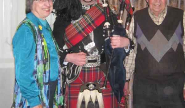 Anne and Jack Dini with a piper in Edinburgh. 