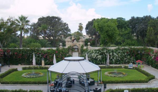 Ornate wrought-iron gates lead to the less-formal second garden.