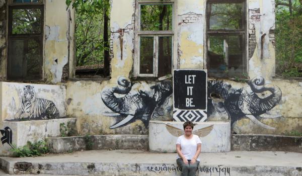 Esther Perica enjoying the “Let It Be”  graffiti in the Yoga Pavilion.