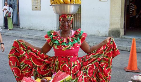 A fruit vendor in traditional costume in the walled city of Cartagena. Photos: Keck