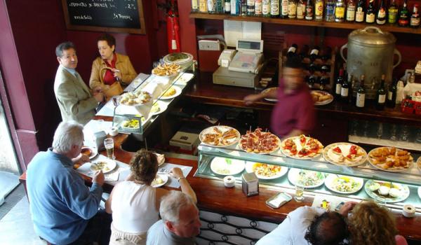 Tempting plates in Spain’s tapas bars make it easy to sample new foods. Photo: Rick Steves