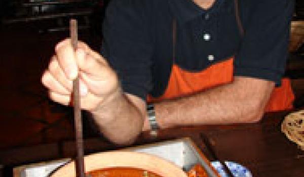  John Scott checking on the Caramel Pork in Clay Pot.