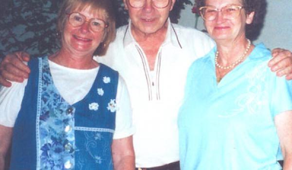 Researcher Dezso and his wife, Kinga (left), with Norine Matteson.