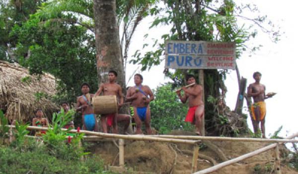 A small band of Emberá men singing and playing instruments made by hand