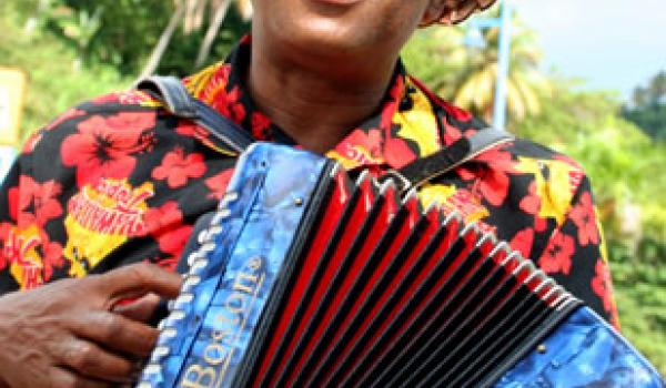 An accordion player welcomes Noordam passengers to the port of Samaná, Domincan 