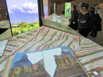 Terroir tables display maps, videos, photos and text — La Cité du Vin in Bordeaux. 