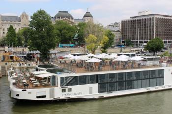 The <i>Viking Skadi</i> and another Viking ship docked in Budapest, the Hotel Grisham Palace off to the left.