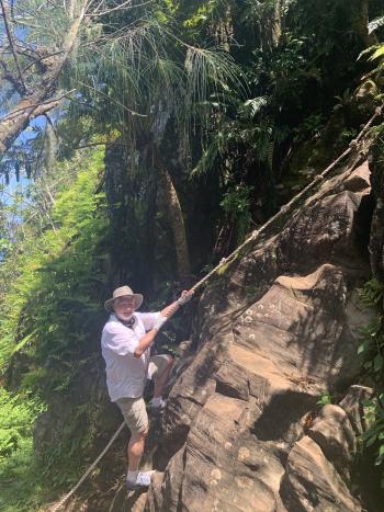 Mike testing the rope on the Raemaru Mountain Track. (We chose not to climb this rock wall.)