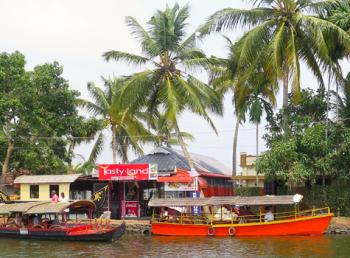 Village shops in the backwaters of India's Kerala state. Photo by John Fleckles