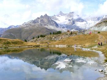 Reflections (including Al and Emily Moore’s) in Leisee Lake at Sunnegga. Photo by Ken Sanner