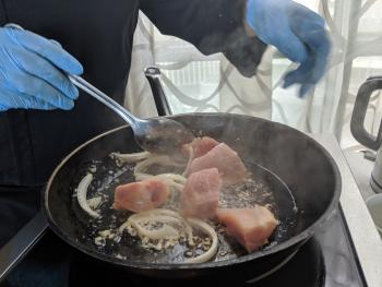 Chicken being sautéed.