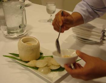 Sprinkling browned sesame seeds onto the cakes. Photo by Sandra Scott