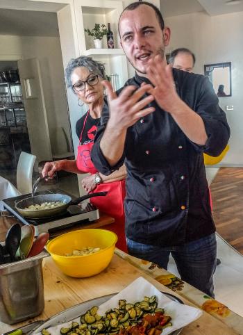 Chef Massimo Tomarchio showing the class how to prepare caponata, which included eggplant, zucchini, pine nuts, raisins, capers and other goodies.