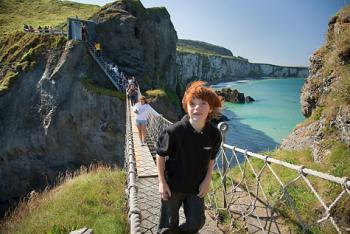 Get your ticket to cross Northern Ireland’s ramshackle Carrick-aRede Rope Bridge first thing in the morning, before the cruise groups — and the wind — take over. Photo by Arizona Bonuccelli