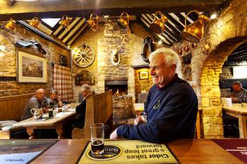 The best way to meet locals in Britain is to cozy up to them at the bar. Photo by Dominic Arizona Bonuccelli